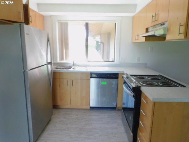 511 Panda Loop Eugene, OR 97401 - Photo 4 of 13 a kitchen with stainless steel appliances granite countertop a refrigerator a stove and a sink