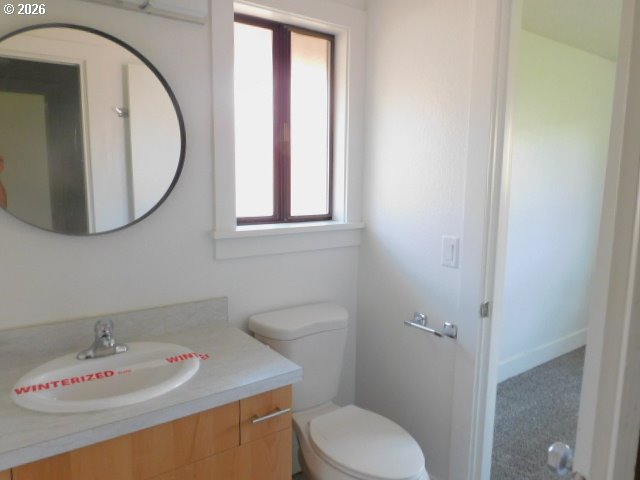 511 Panda Loop Eugene, OR 97401 - Photo 9 of 13 a bathroom with a sink a toilet and a mirror
