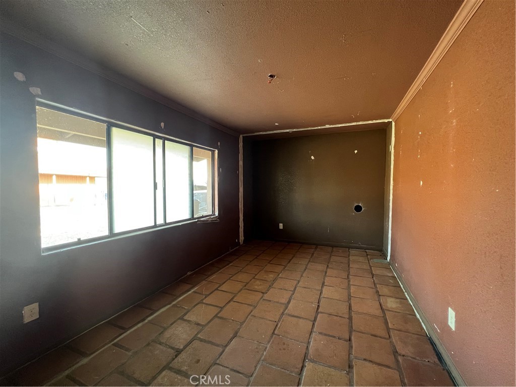 30643 Scott Road Menifee, CA 92584 - Photo 5 of 13 a view of an empty room and window