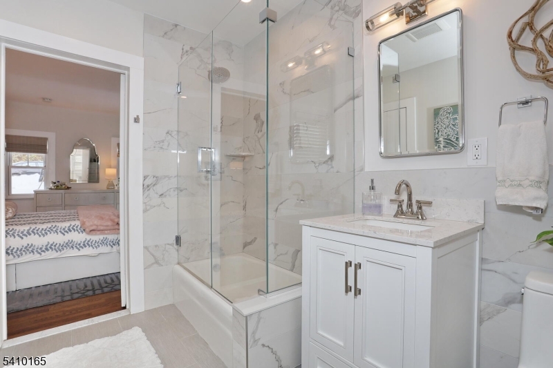 2 Maysenger Road Mahwah, NJ 07430 - Photo 13 of 28 a bathroom with a granite countertop sink mirror and shower