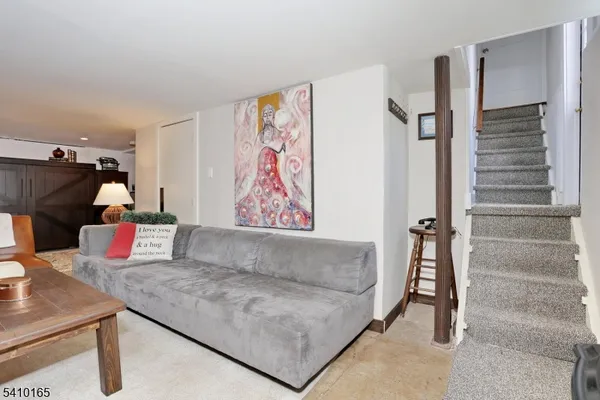 a view of a livingroom with furniture and a couch