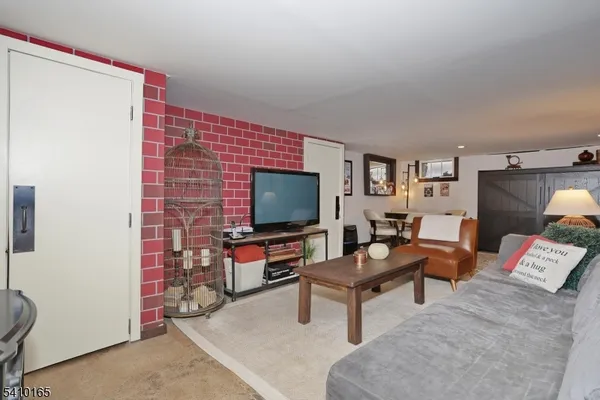 a view of a livingroom with furniture and furniture
