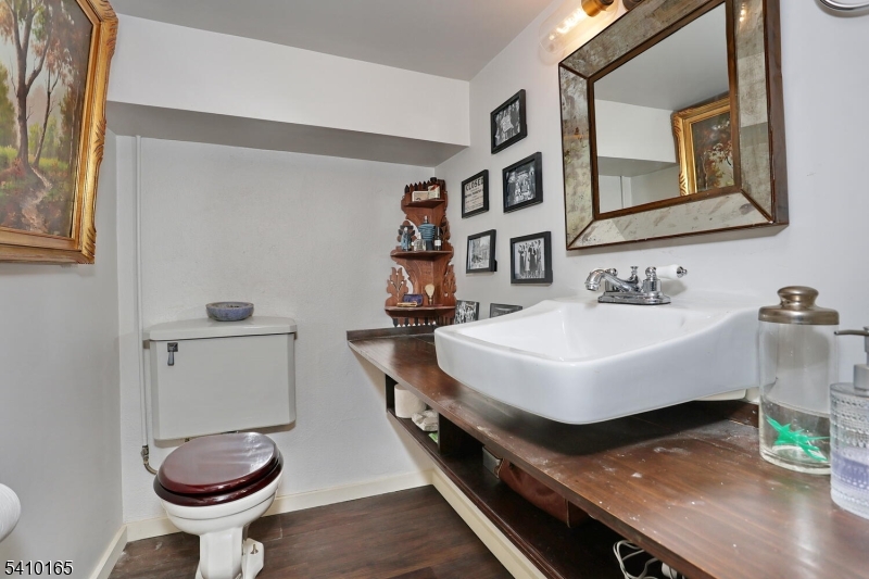 2 Maysenger Road Mahwah, NJ 07430 - Photo 21 of 28 a bathroom with a sink a toilet and a mirror