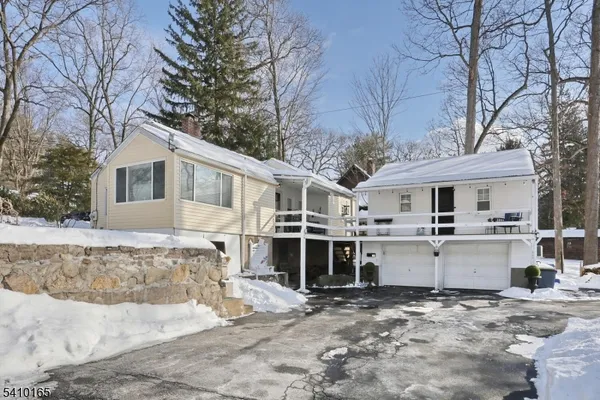 a view of backyard with swimming pool and outdoor seating