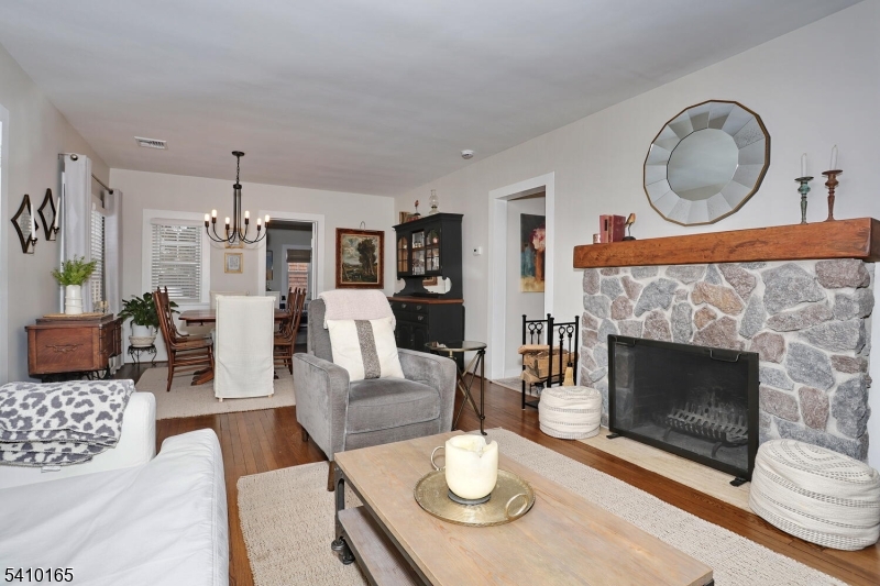 2 Maysenger Road Mahwah, NJ 07430 - Photo 4 of 28 a living room with furniture a dining table and a fireplace