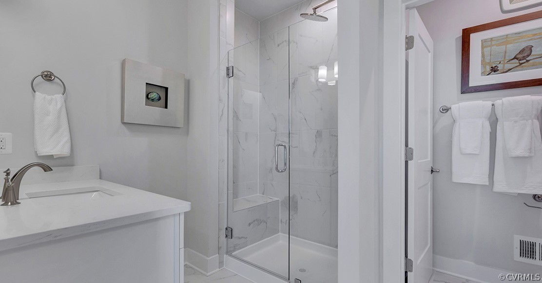 200 Brattice Drive Midlothian, VA 23114 - Photo 17 of 35 a bathroom with a sink and mirror