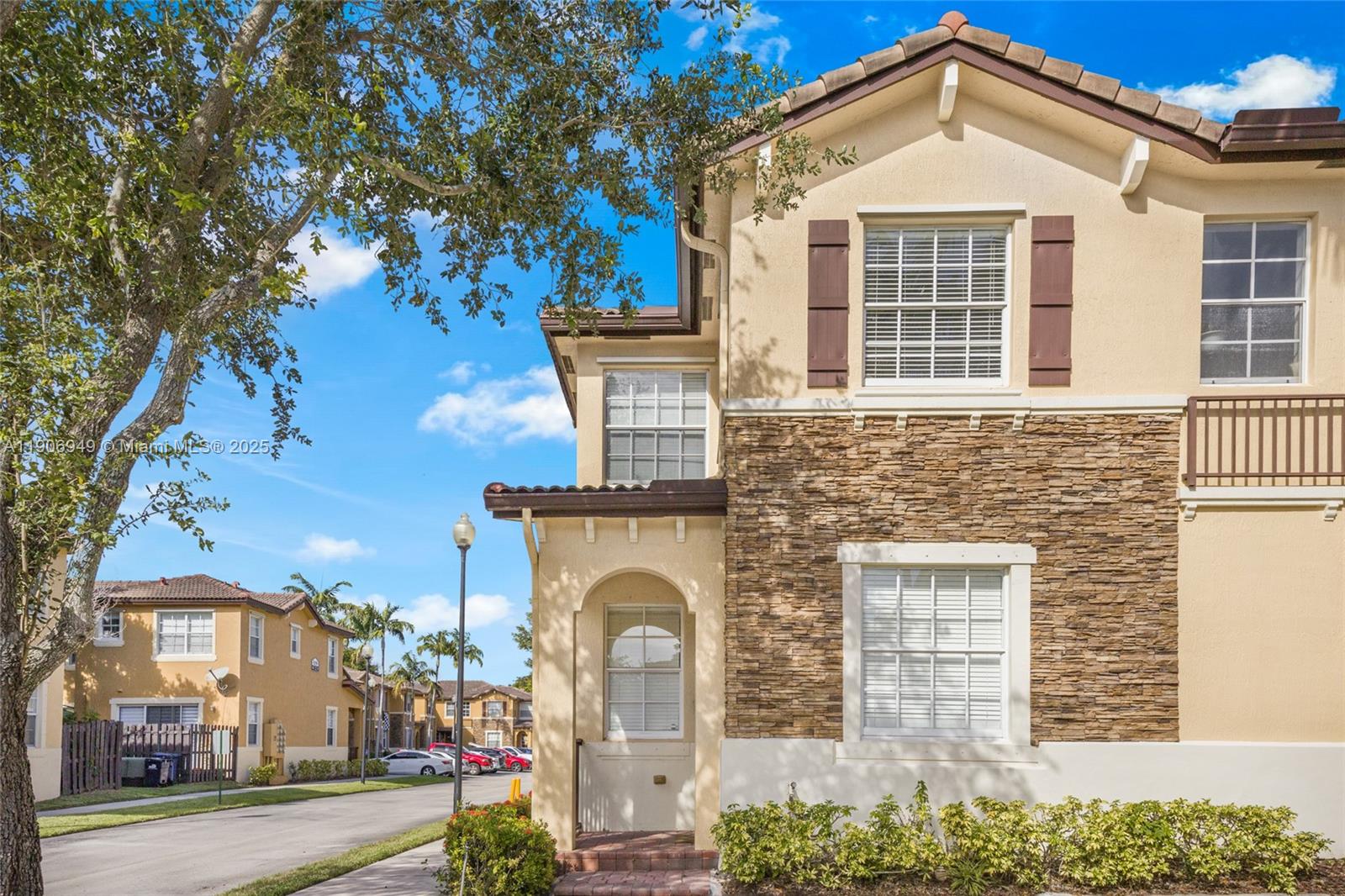 9239 Southwest 227th Street, Unit 1 Cutler Bay, FL 33190 - Photo 1 of 37 a front view of a house with a yard