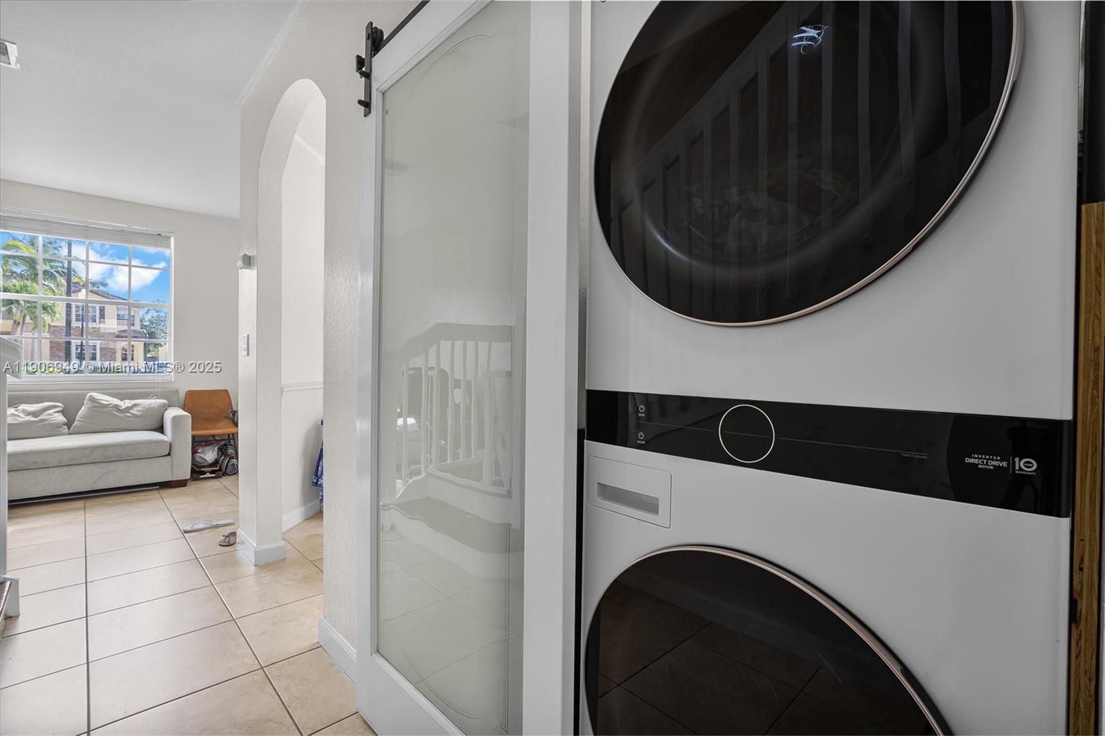9239 Southwest 227th Street, Unit 1 Cutler Bay, FL 33190 - Photo 14 of 37 a utility room with dryer and washer