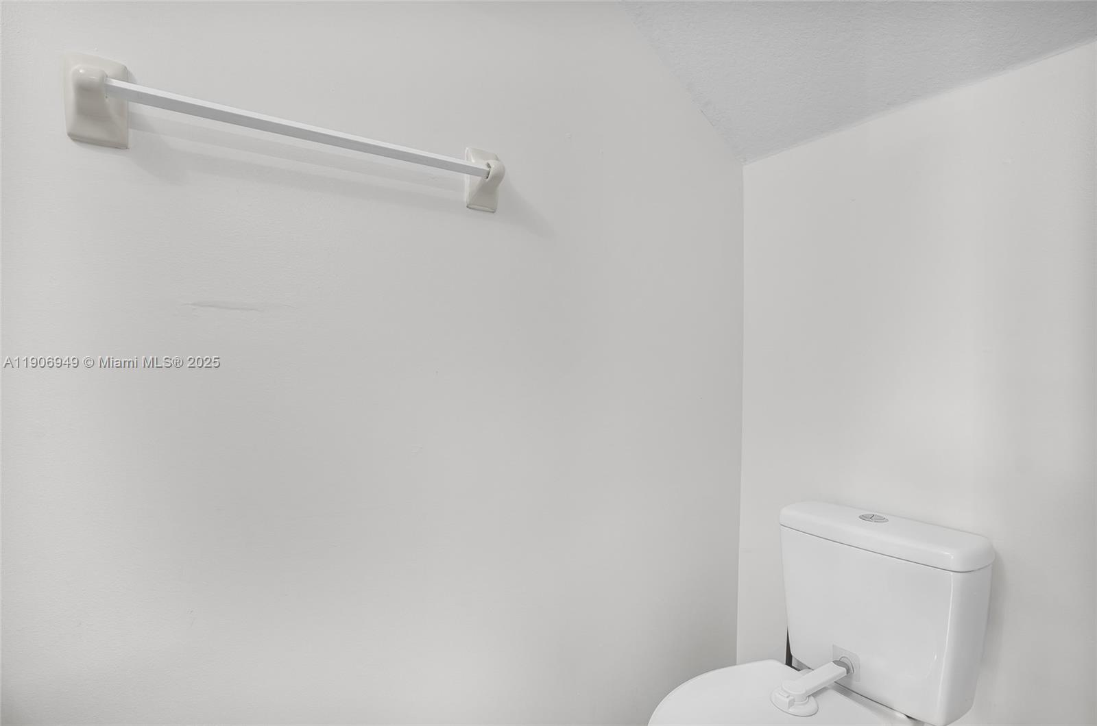 9239 Southwest 227th Street, Unit 1 Cutler Bay, FL 33190 - Photo 16 of 37 a white toilet sitting next to a shower