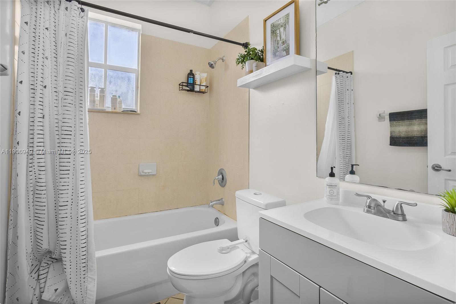 9239 Southwest 227th Street, Unit 1 Cutler Bay, FL 33190 - Photo 22 of 37 a bathroom with a sink toilet and shower