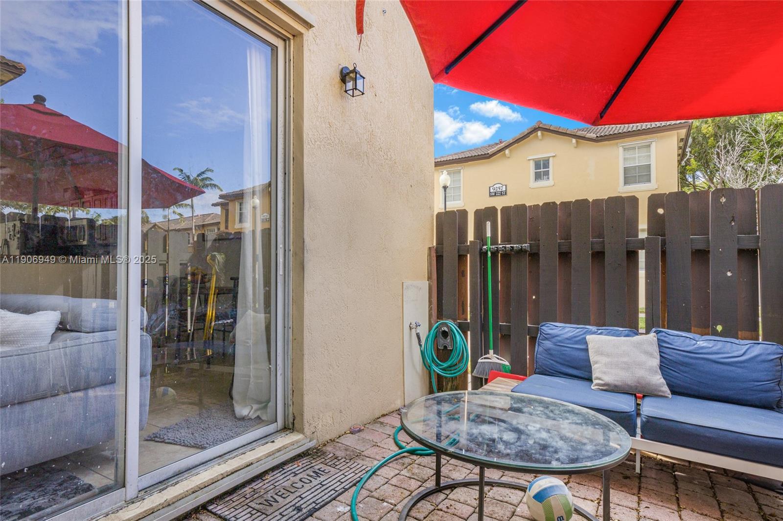 9239 Southwest 227th Street, Unit 1 Cutler Bay, FL 33190 - Photo 23 of 37 a backyard of a house with barbeque oven table and chairs