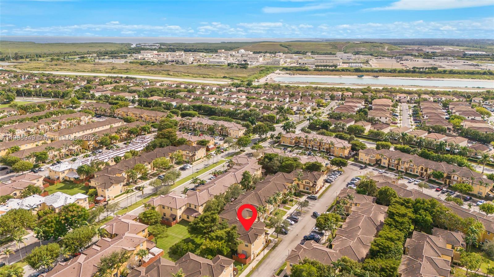 9239 Southwest 227th Street, Unit 1 Cutler Bay, FL 33190 - Photo 30 of 37 an aerial view of residential building and ocean
