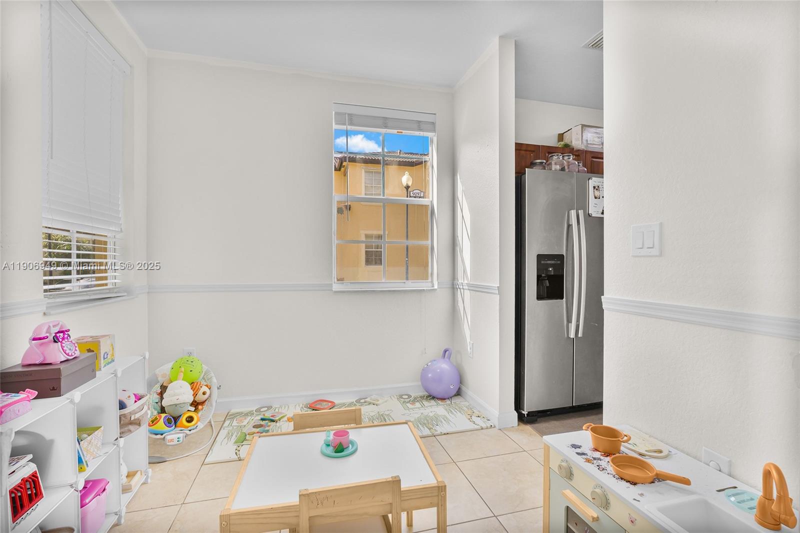 9239 Southwest 227th Street, Unit 1 Cutler Bay, FL 33190 - Photo 7 of 37 a bedroom with a bed and a dresser in it