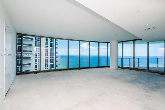 a kitchen with a stove a refrigerator and washer