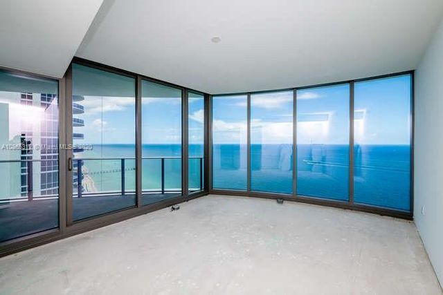 a view of a room with sliding glass door