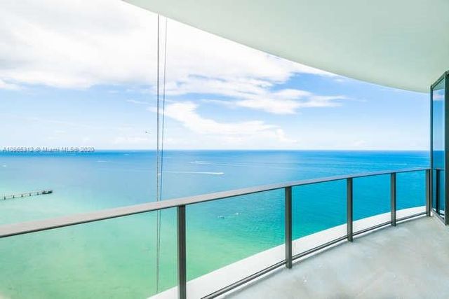 an empty room with closet and a bathroom view