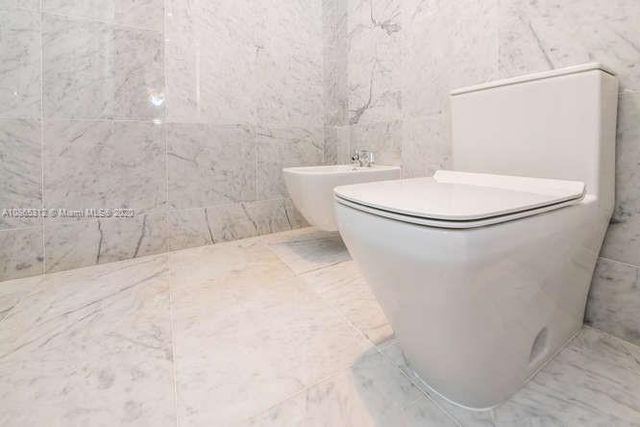 a view of a building with a yard