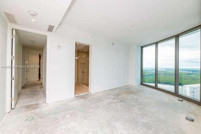 a view of a swimming pool with a garden and plants