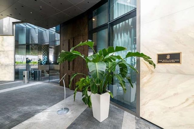 a view of a living room and entry way