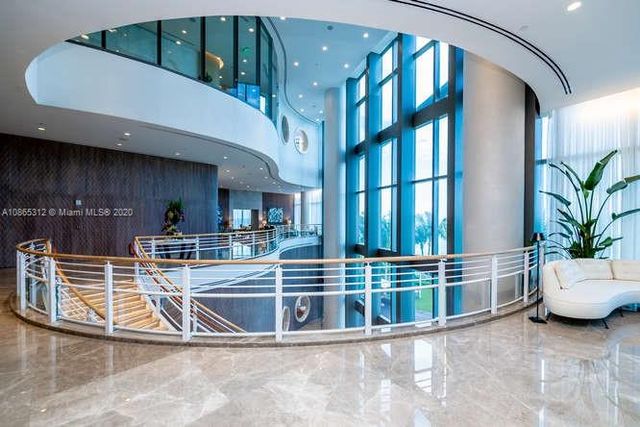 an empty room with sliding glass door and shower