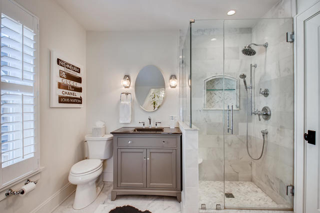 161 Washington Circle Lake Forest, IL 60045 - Photo 16 of 25 a bathroom with a granite countertop sink toilet and shower