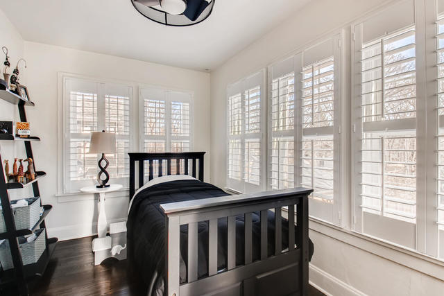 161 Washington Circle Lake Forest, IL 60045 - Photo 21 of 25 a bedroom with a bed a dresser and a large window