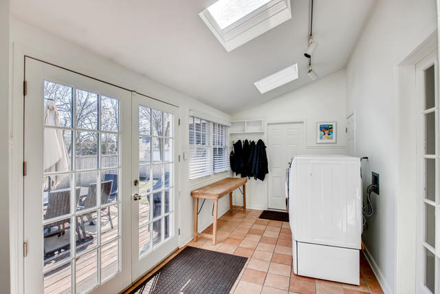 161 Washington Circle Lake Forest, IL 60045 - Photo 23 of 25 a kitchen with a refrigerator a stove top oven and a large window