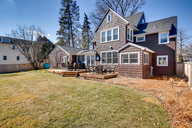 161 Washington Circle Lake Forest, IL 60045 - Photo 25 of 25 a view of a white house with large trees next to a road