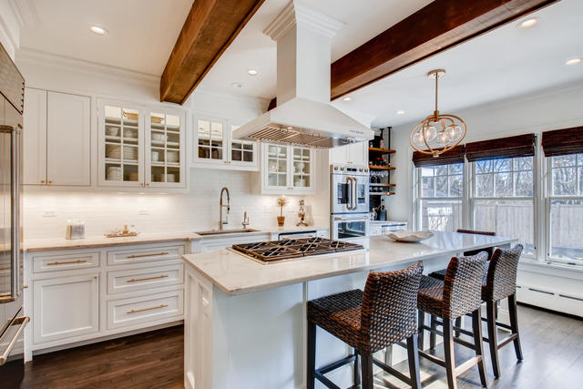161 Washington Circle Lake Forest, IL 60045 - Photo 7 of 25 a dining room with wooden floor a chandelier a wooden table and chairs