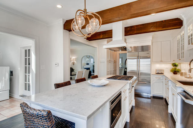 161 Washington Circle Lake Forest, IL 60045 - Photo 8 of 25 a kitchen with stainless steel appliances granite countertop a sink a stove and a wooden floors