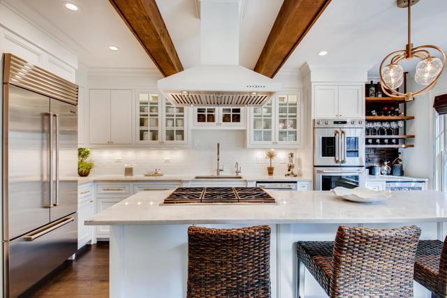 161 Washington Circle Lake Forest, IL 60045 - Photo 9 of 25 a kitchen with stainless steel appliances granite countertop a stove a sink dishwasher and cabinets with wooden floor