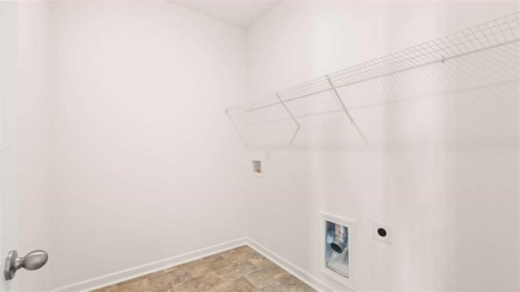 13599 Whitman Lane Covington, GA 30014 - Photo 33 of 51 a view of a room with racks on the wall