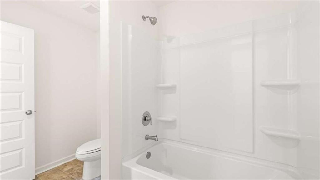 13599 Whitman Lane Covington, GA 30014 - Photo 48 of 51 a bath room with a toilet and a bath tub