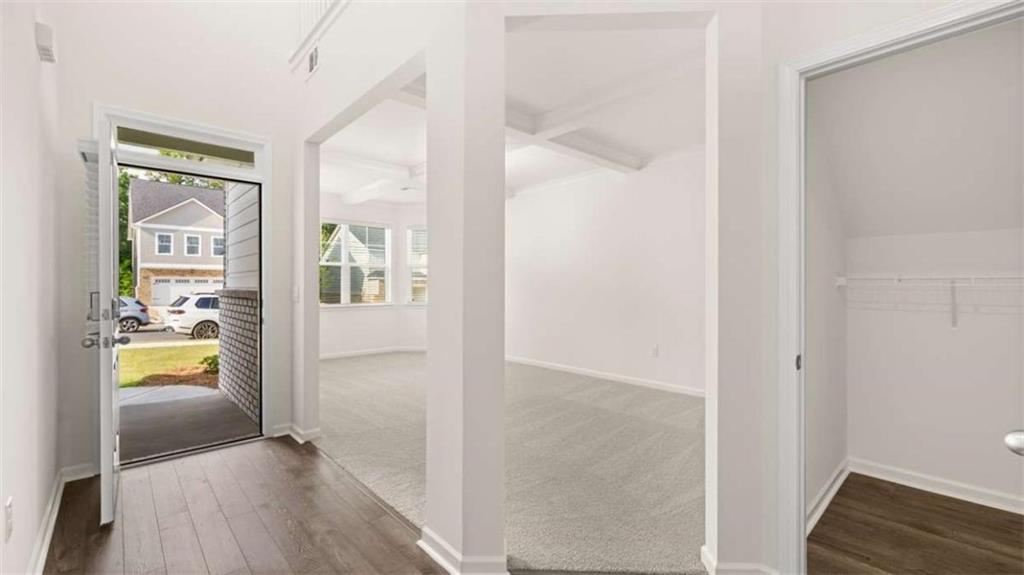 13599 Whitman Lane Covington, GA 30014 - Photo 6 of 51 a view of a hallway view with wooden floor and a bathroom
