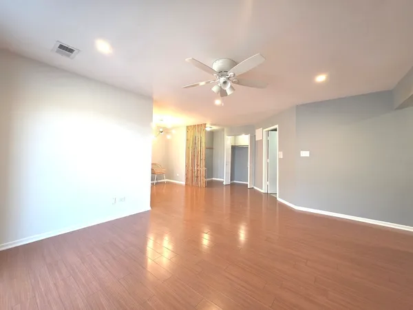 a large kitchen with stainless steel appliances granite countertop a sink and dishwasher a stove with wooden floors