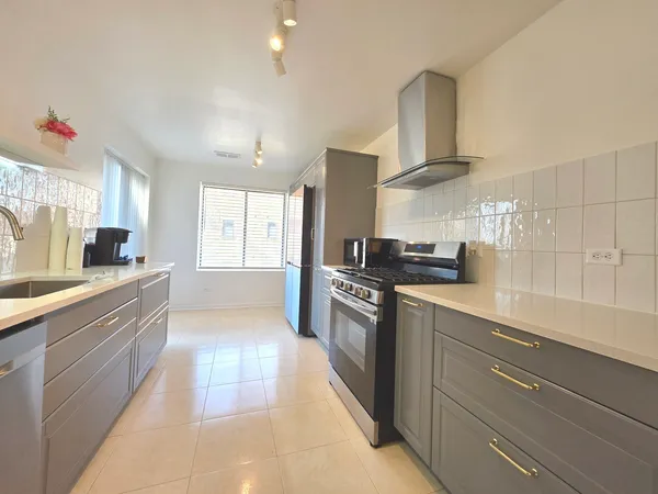 a kitchen with a stove and a microwave