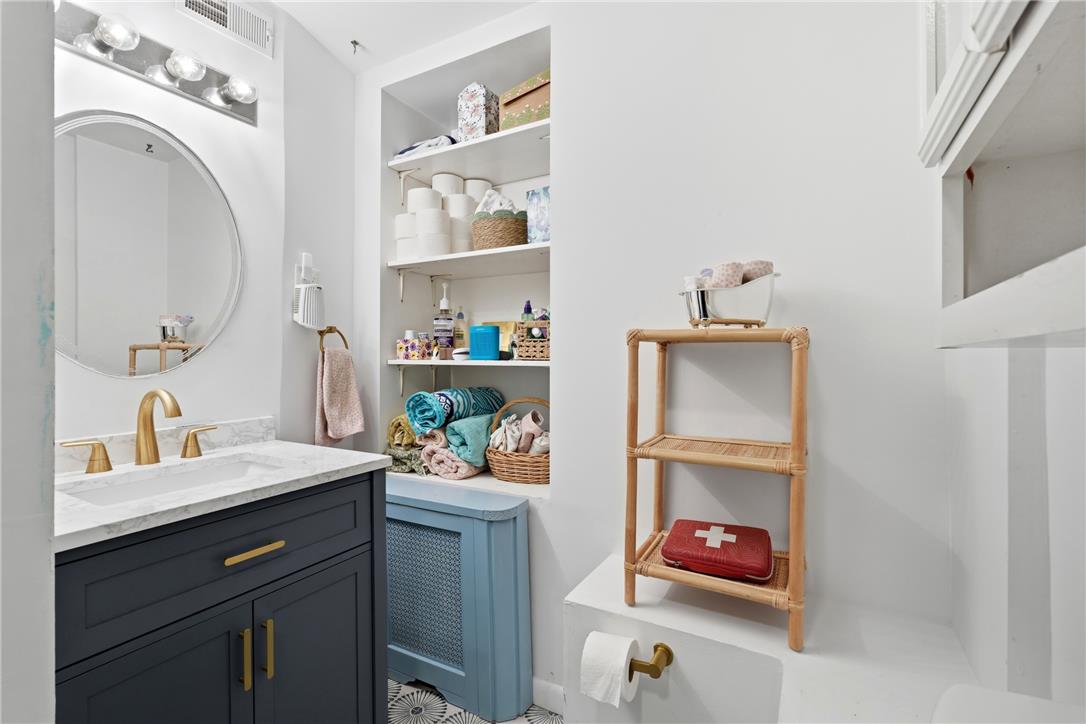 809 Hayes Street Bethlehem, PA 18015 - Photo 16 of 31 Modern vanity and built-in shelving maximize space in this bathroom design.