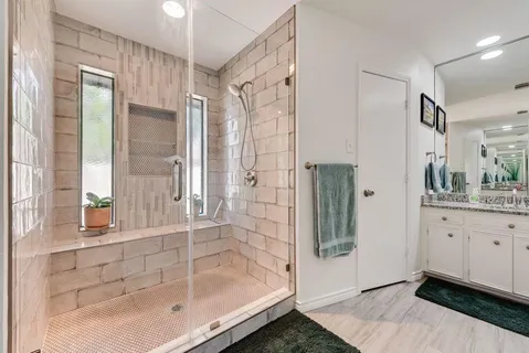 a bathroom with a bathtub and a sink