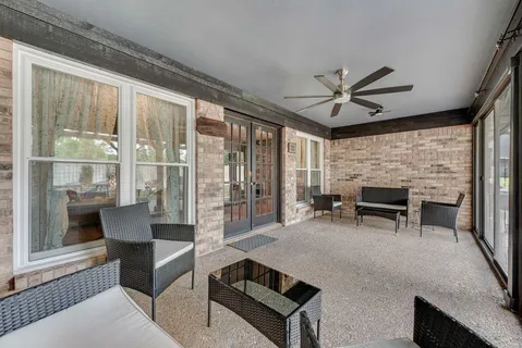 a living room with furniture a fireplace and a table