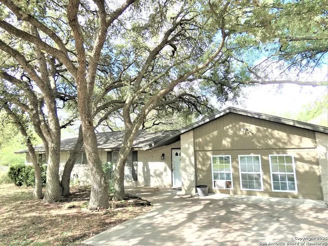 a view of a large building with large trees