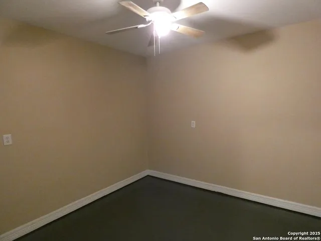 an empty room with wooden floor