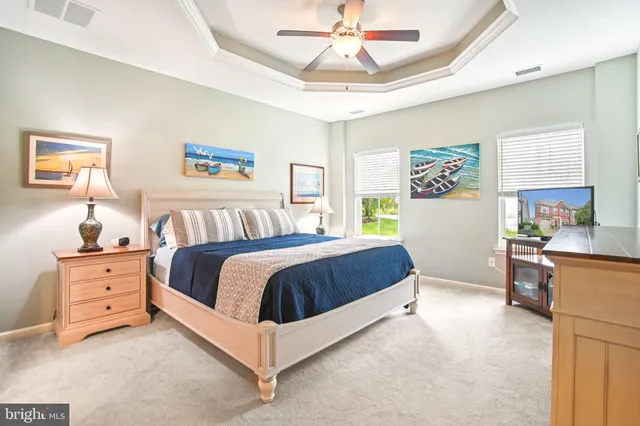 a bedroom with a bed and wall painting