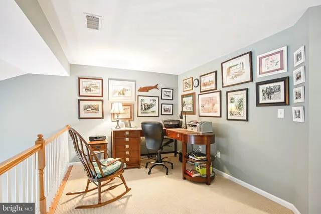 a bedroom with furniture and wooden floor