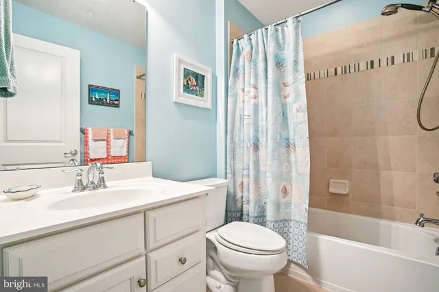 front view of a brick house with a yard