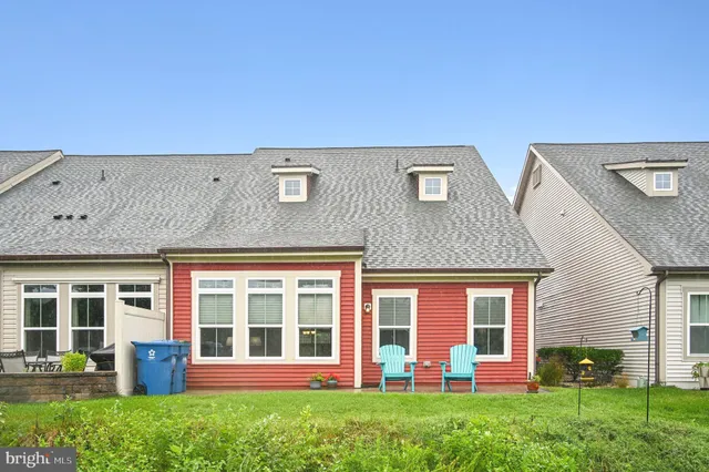 a picture of a bench in front of a building
