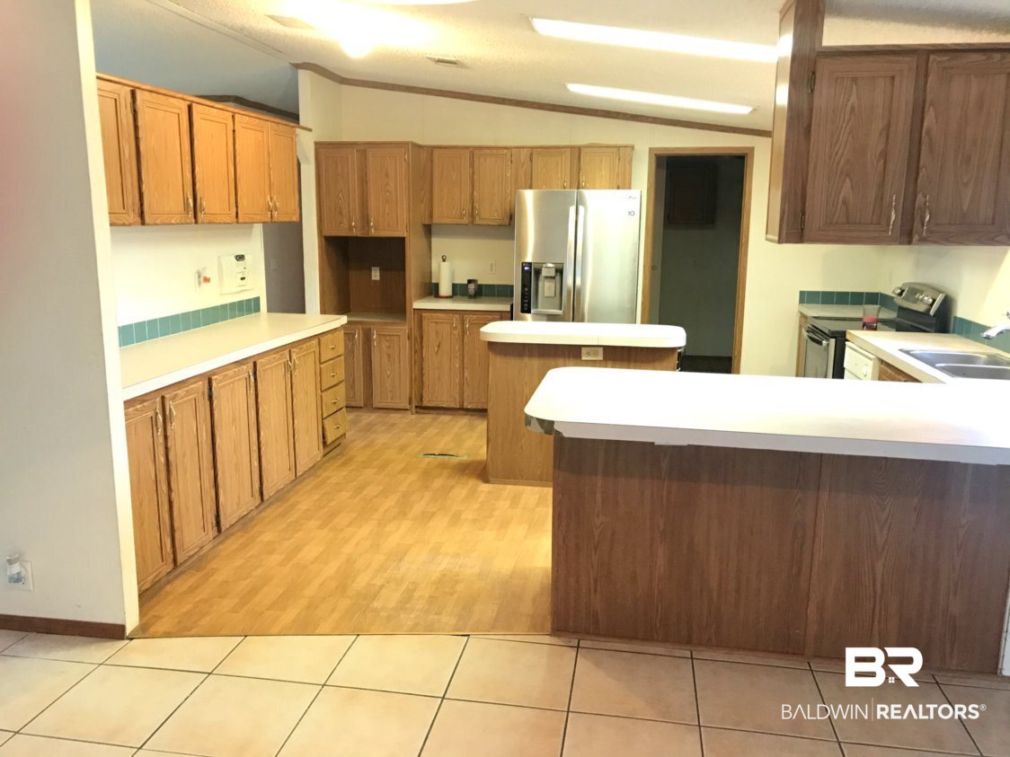 33088 Gilley Road Lillian, AL 36549 - Photo 6 of 11 Kitchen Bar and Cabinets