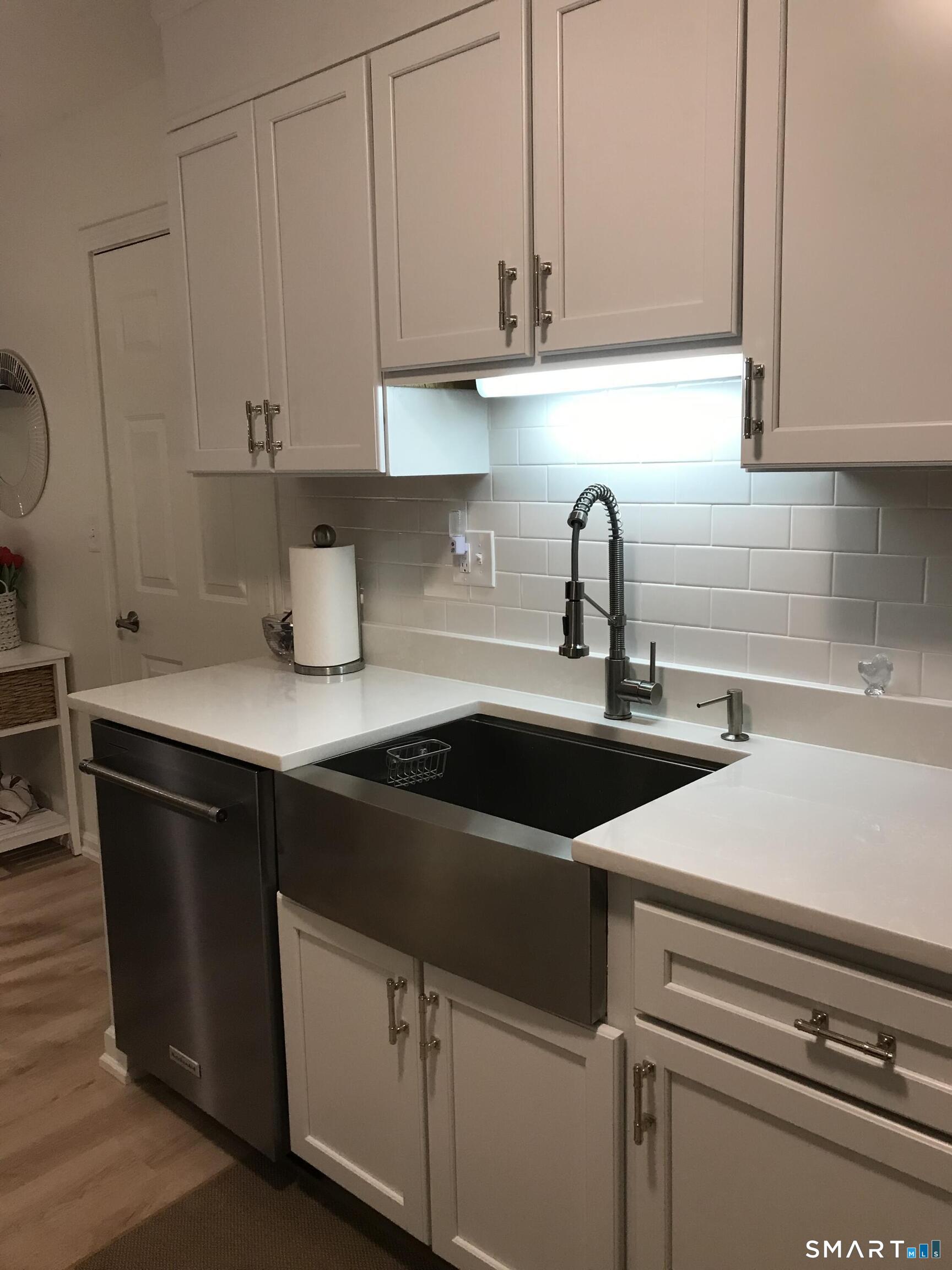 449 The Meadows Enfield, CT 06082 - Photo 3 of 11 a kitchen with a sink and cabinets