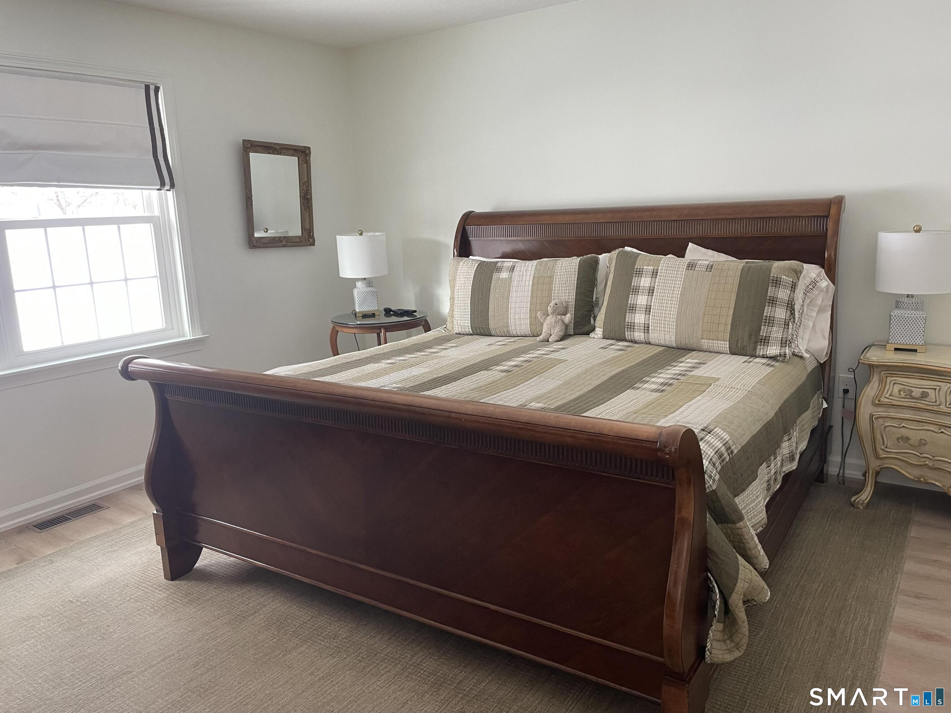 449 The Meadows Enfield, CT 06082 - Photo 6 of 11 a bedroom with a bed and a window