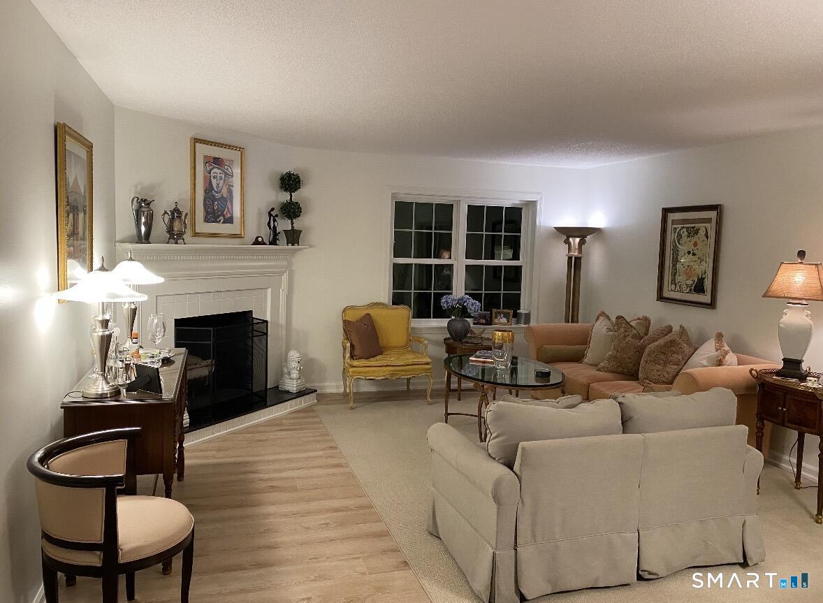 449 The Meadows Enfield, CT 06082 - Photo 7 of 11 a living room with furniture and a fireplace