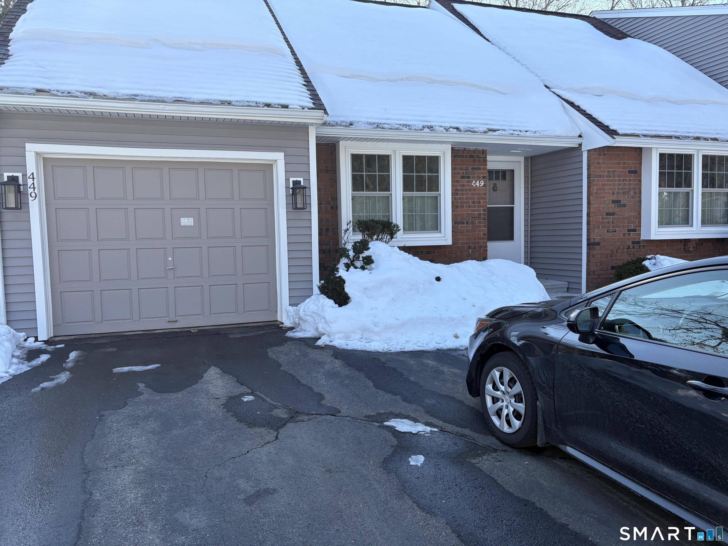 449 The Meadows Enfield, CT 06082 - Photo 9 of 11 a car parked in front of a house